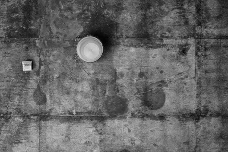 Dirty stained concrete driveway before power washing